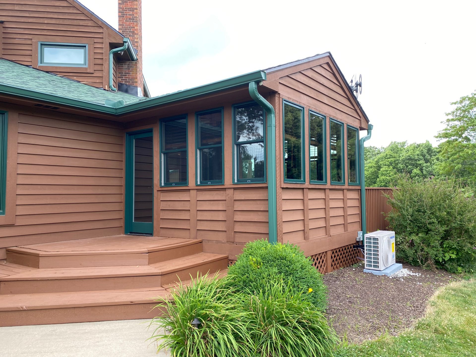 The back of a house with a deck and stairs