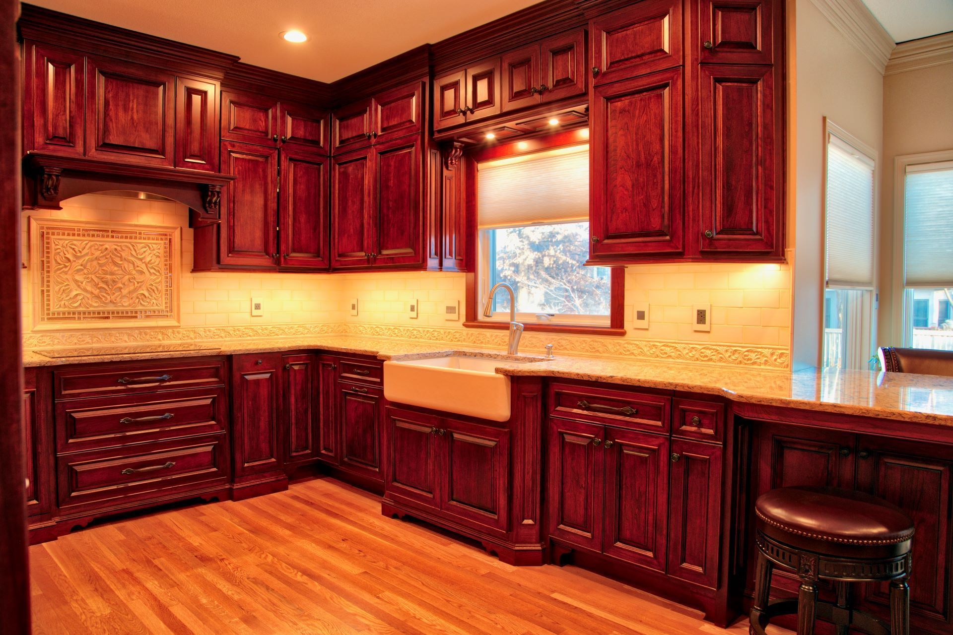 A kitchen with wooden cabinets and a sink.