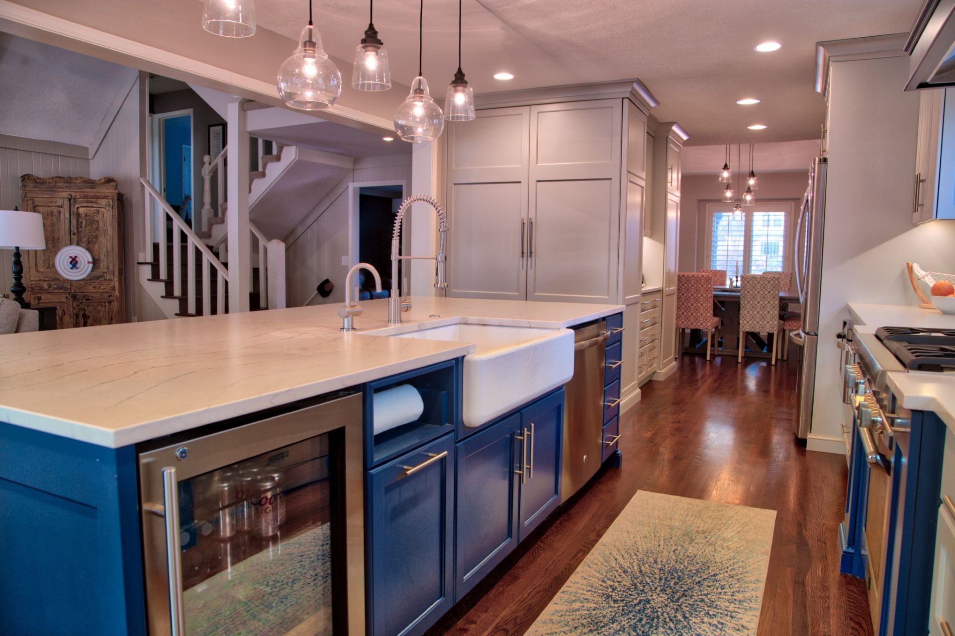 A living room with a couch , fireplace and television.