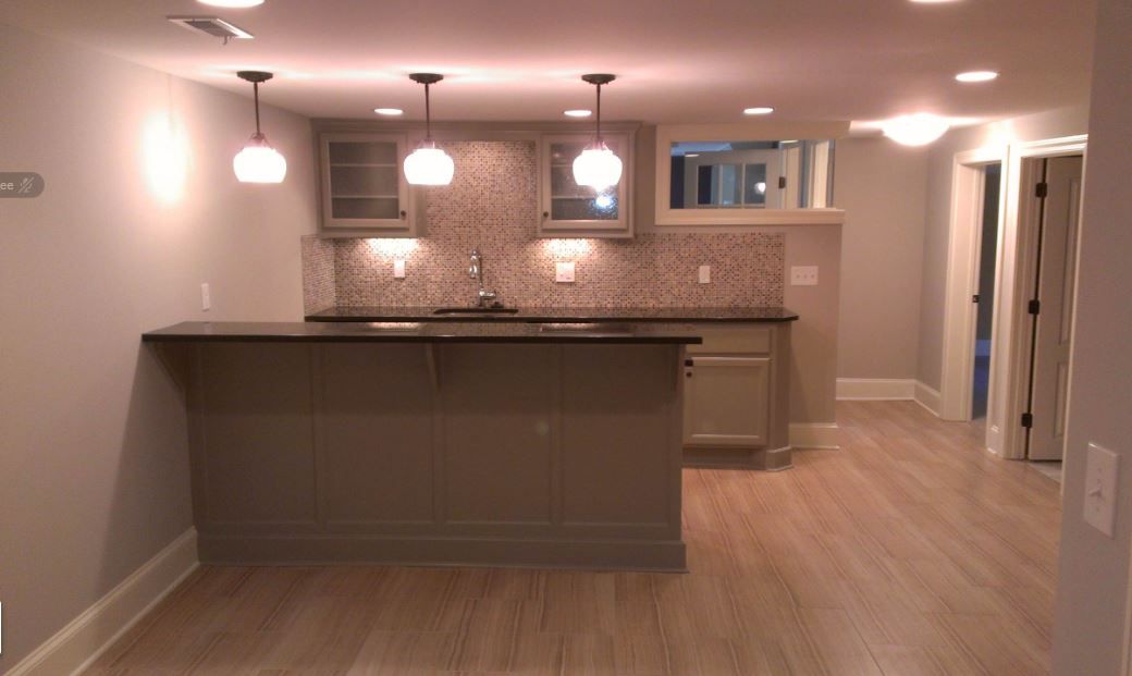 A kitchen with a large island in the middle of the room.