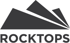 A black and white logo for rocktops with a mountain in the background