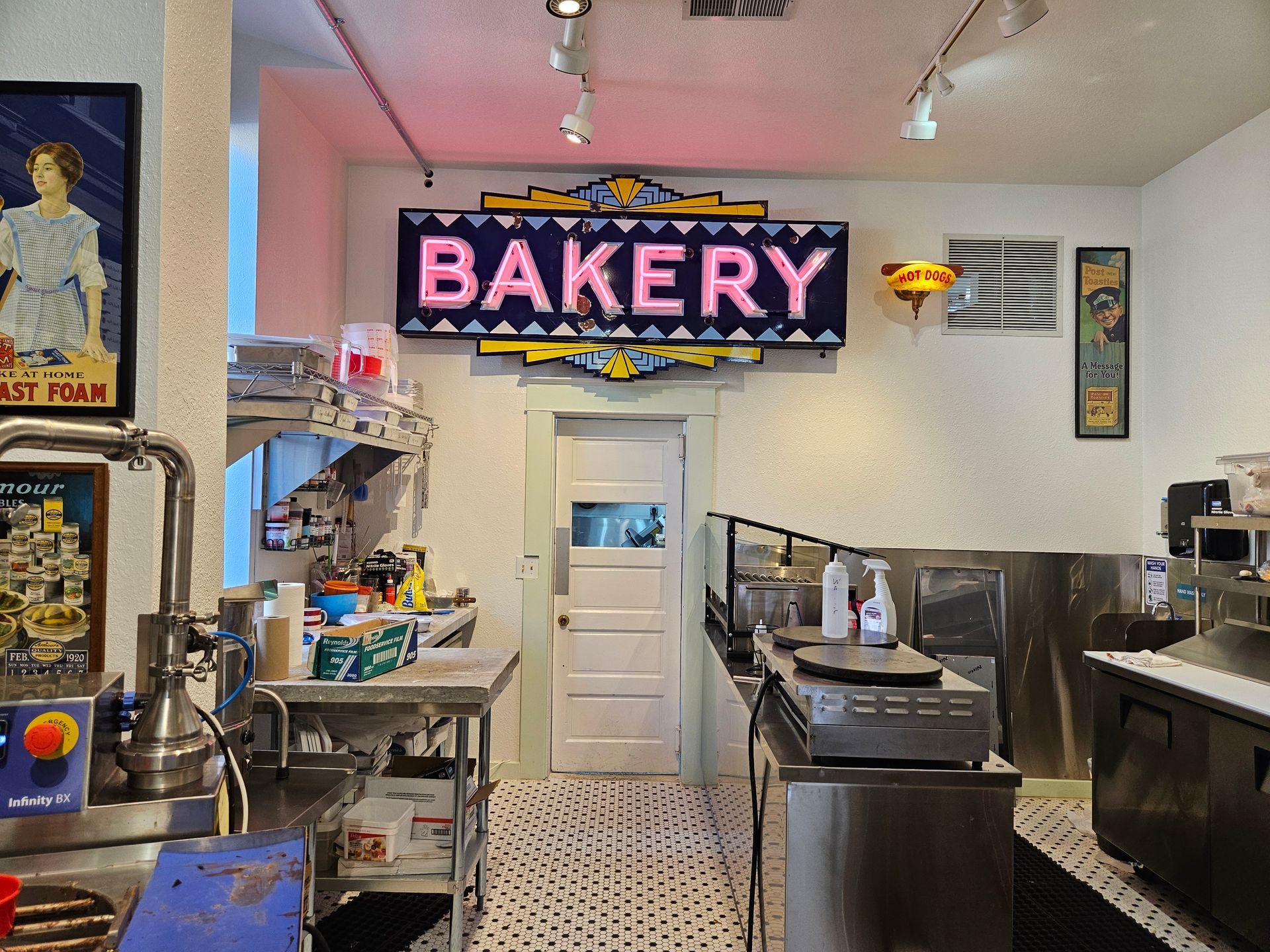 A kitchen with a sign that says bakery on it