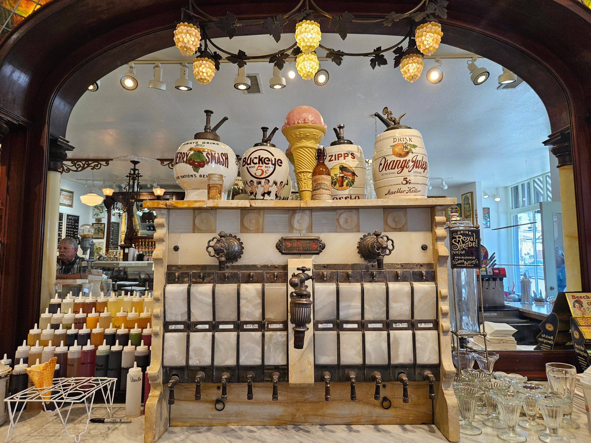 A display of ice cream cones and bottles in a store