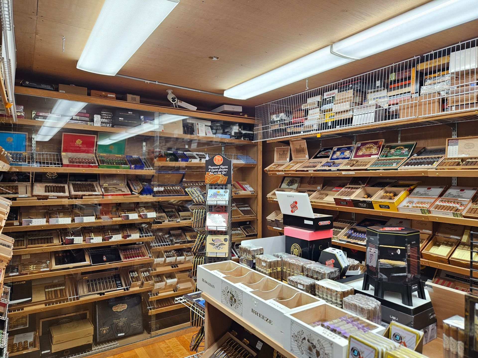 A store filled with lots of shelves and boxes of cigars.