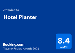 Booking.com Traveler Review Award badge for Hotel Planter, blue with 8.4 out of 10 score