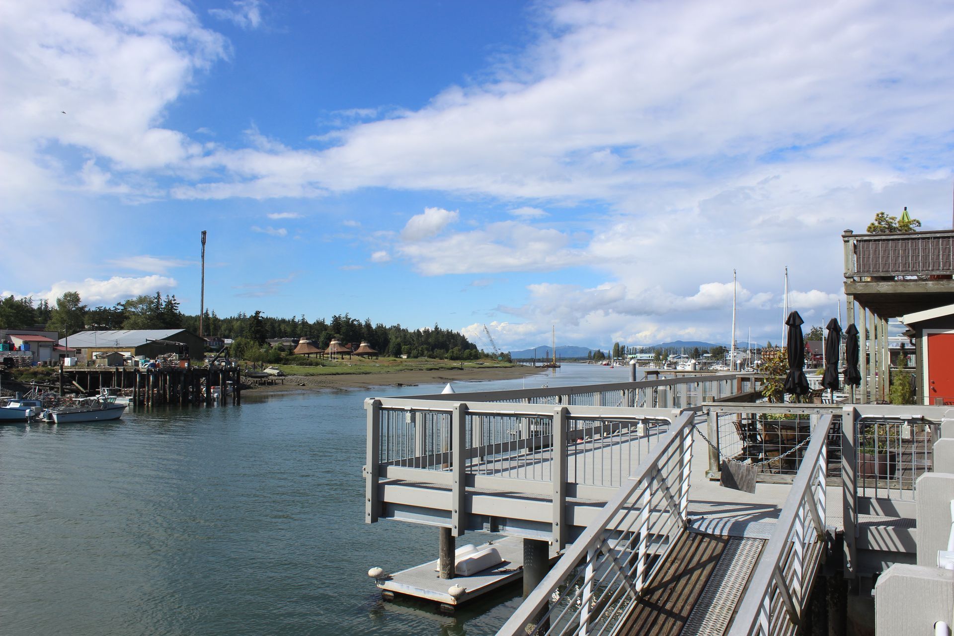 A dock overlooking a body of water with boats in it