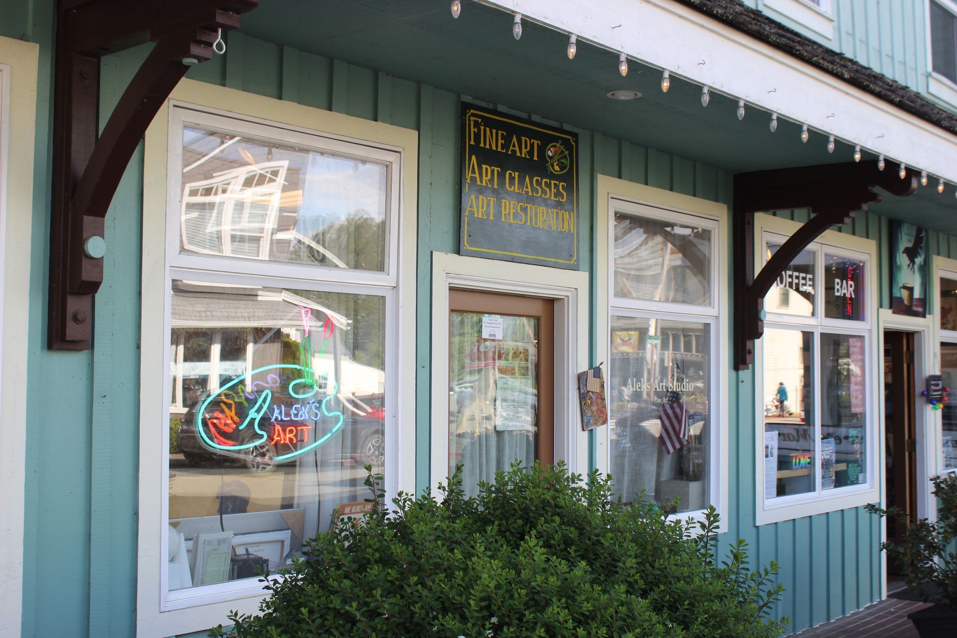A blue building with a sign that says tiffany 's