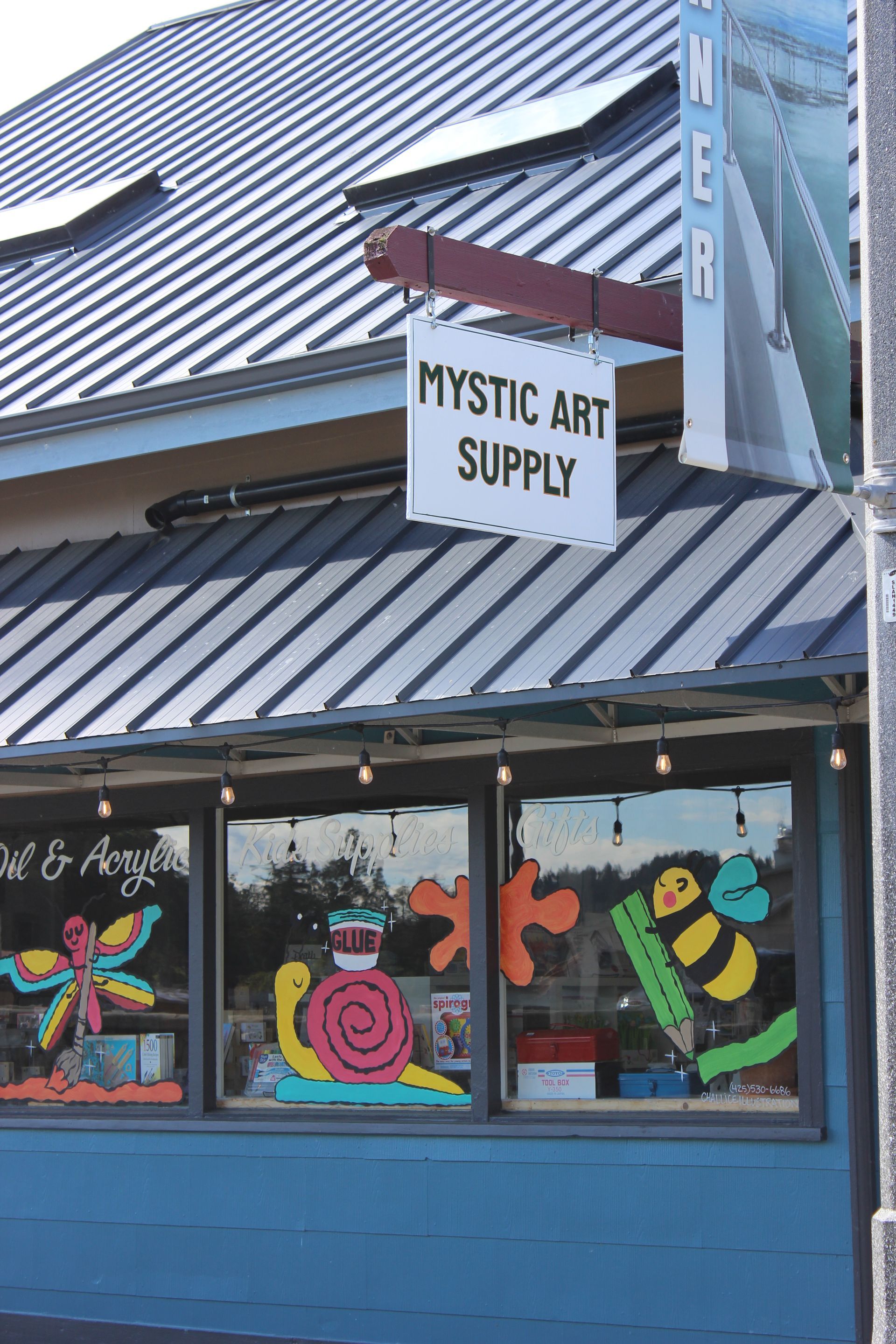 A blue building with a sign that says mystic art supply