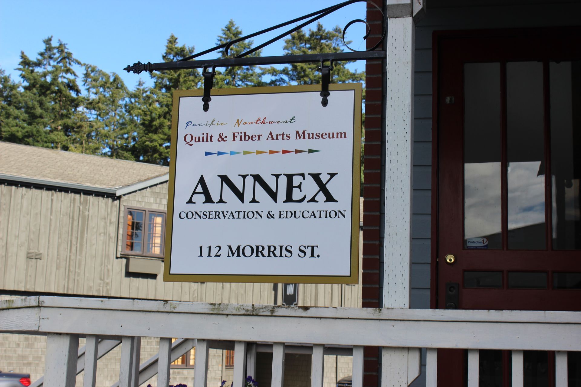 A sign for the annex quilt and fiber arts museum
