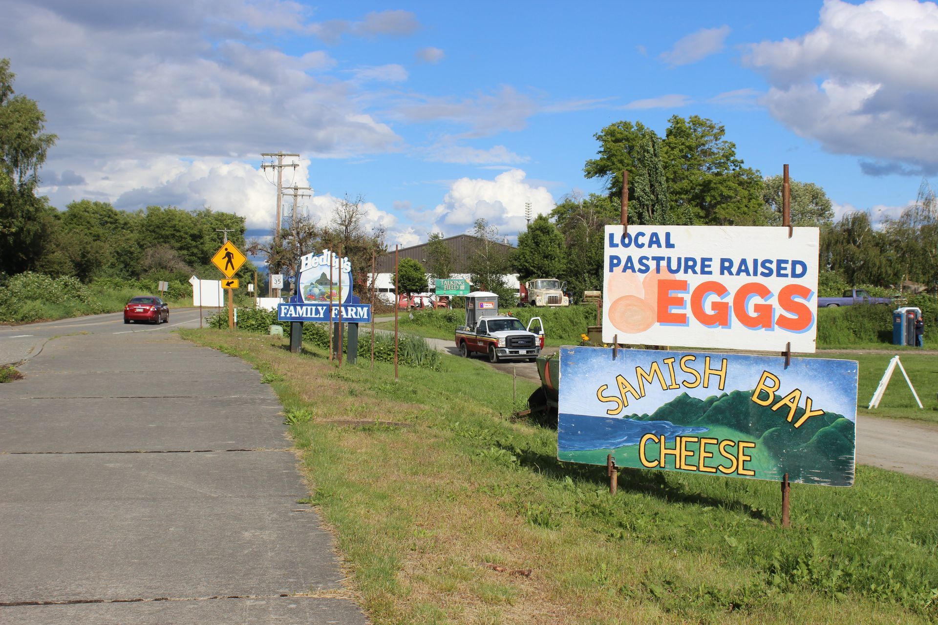 A sign that says local pasture raised eggs on it