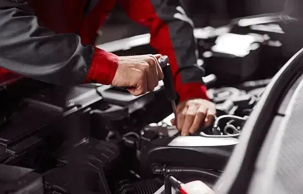 Technician performing Maintenance on Vehicl | Rux Auto Garage Inc