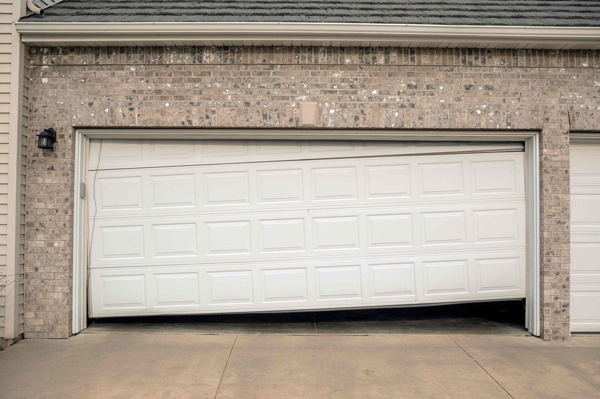 Misaligned Or Damaged Garage Door Tracks — Rifle, CO — Bailey’s Garage Doors & More