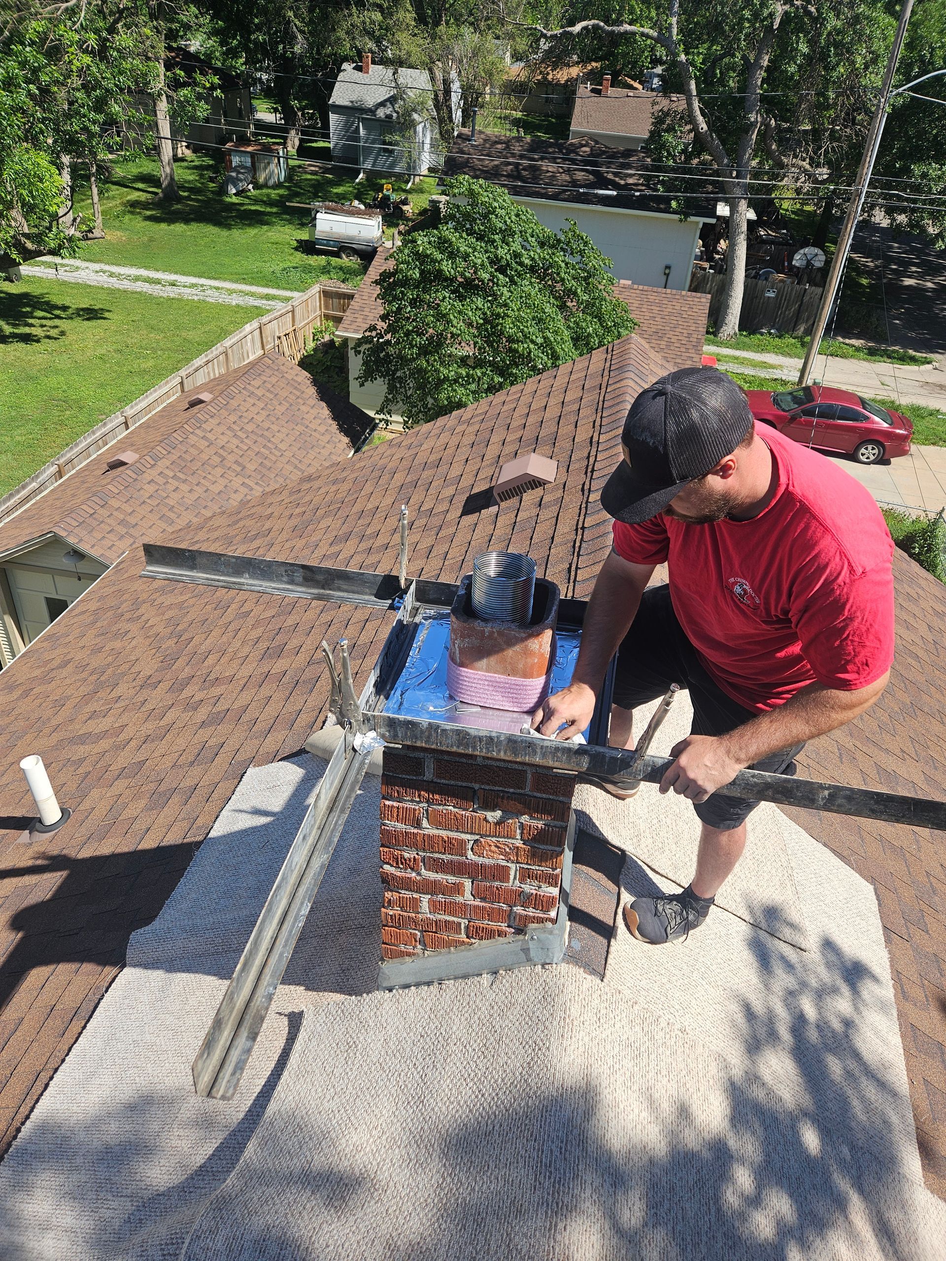 a man is cleaning a fireplace with a shovel .