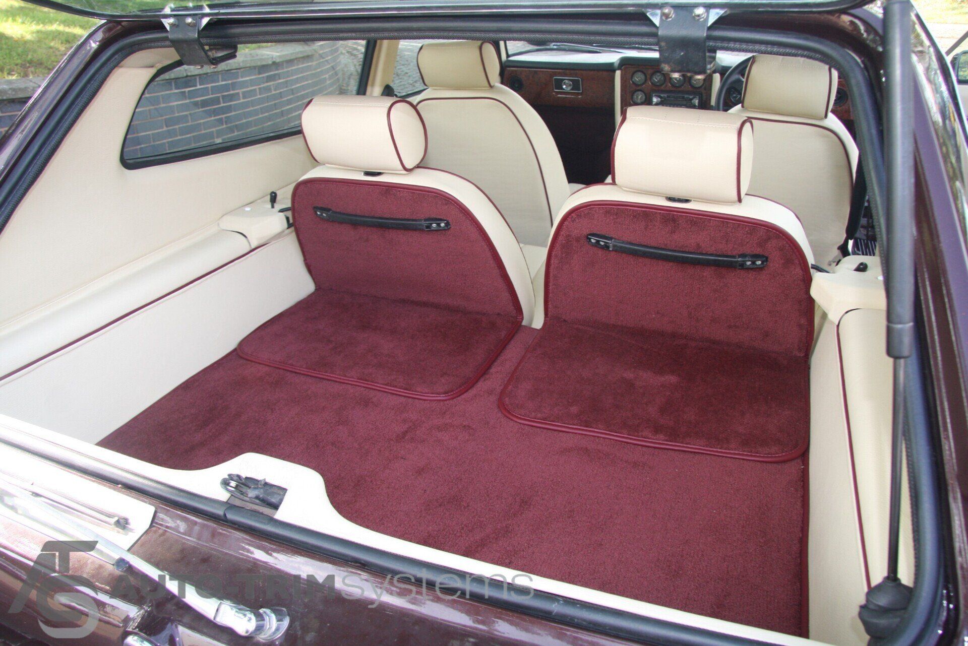 Bespoke plush red carpet in a Reliant Scimitar