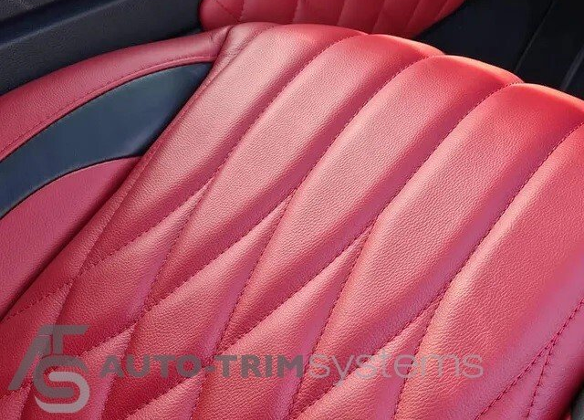 Premium red leather automotive upholstery with customised panel designs