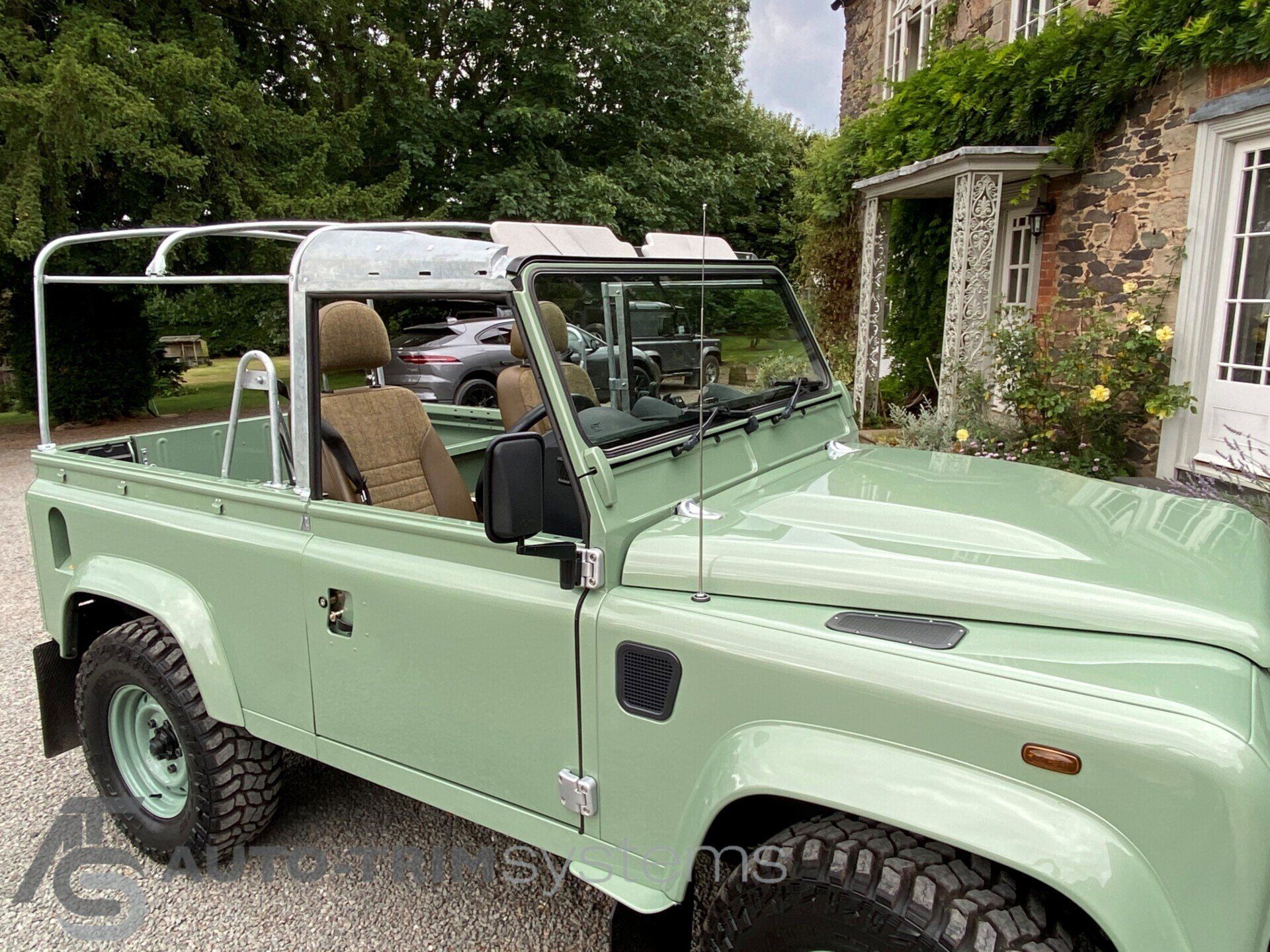 Light green Landrover Defender with customised tweed interior