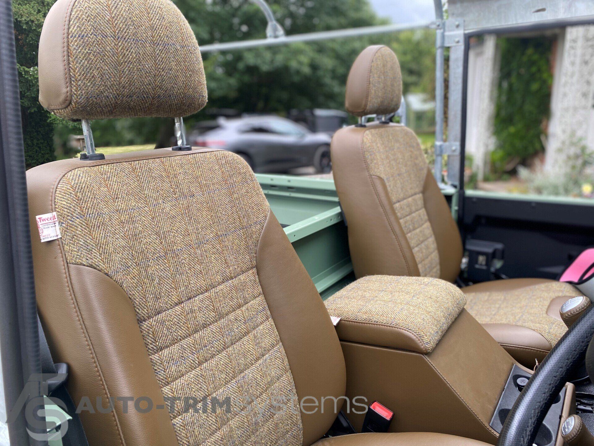 Light green Landrover Defender with customised tweed seats