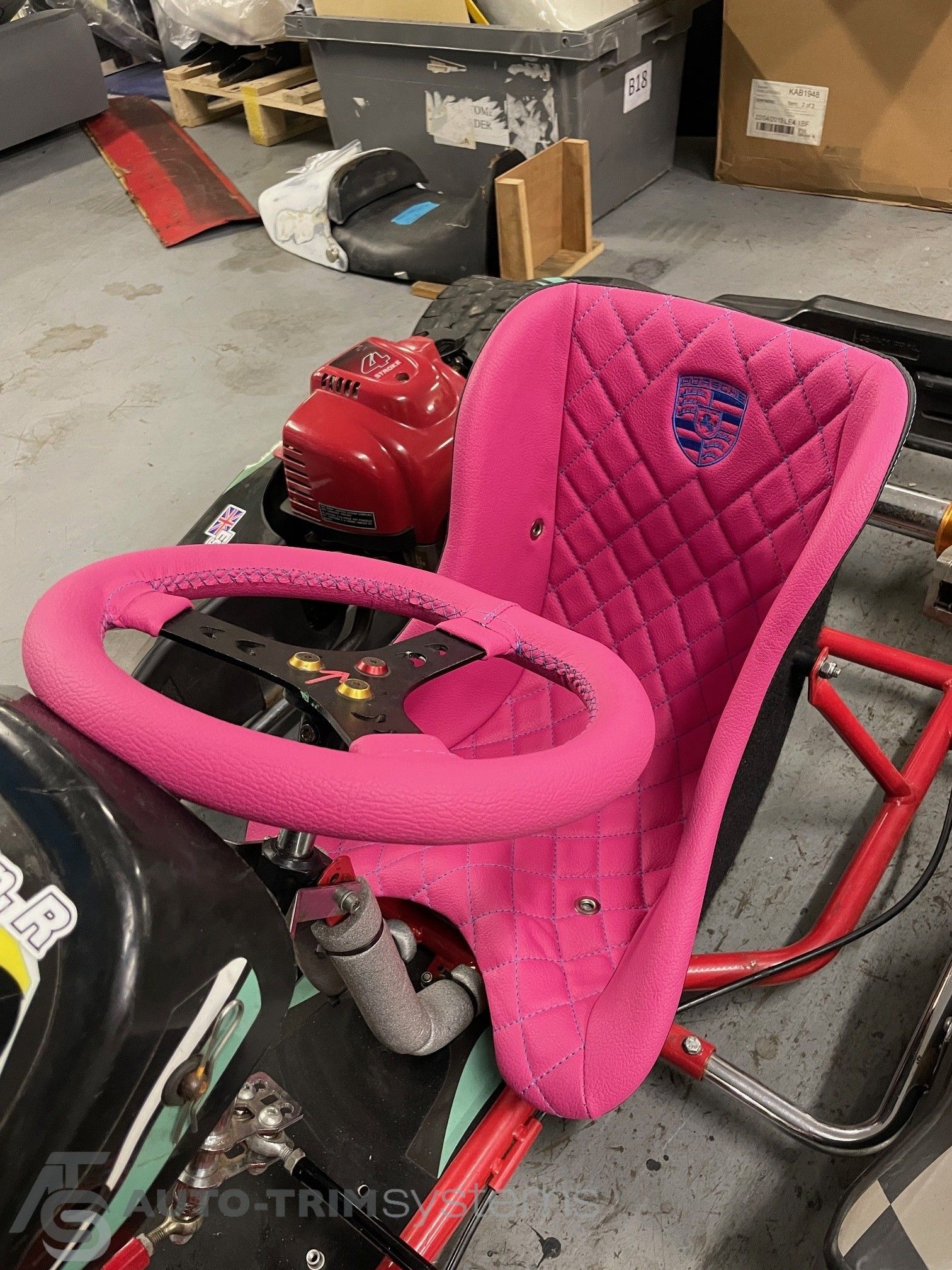Go-Kart seat & steering wheel re-trimmed in pink with Porsche embroidered badge.