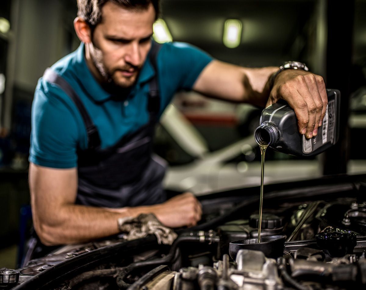 Mechanic Changing Oil on the Vehicle — Lynden, WA — Wayne’s Car Care Repair