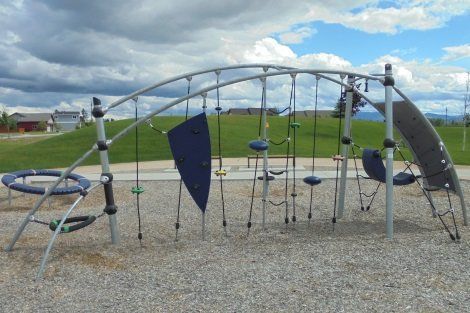 A playground with a blue shield on it