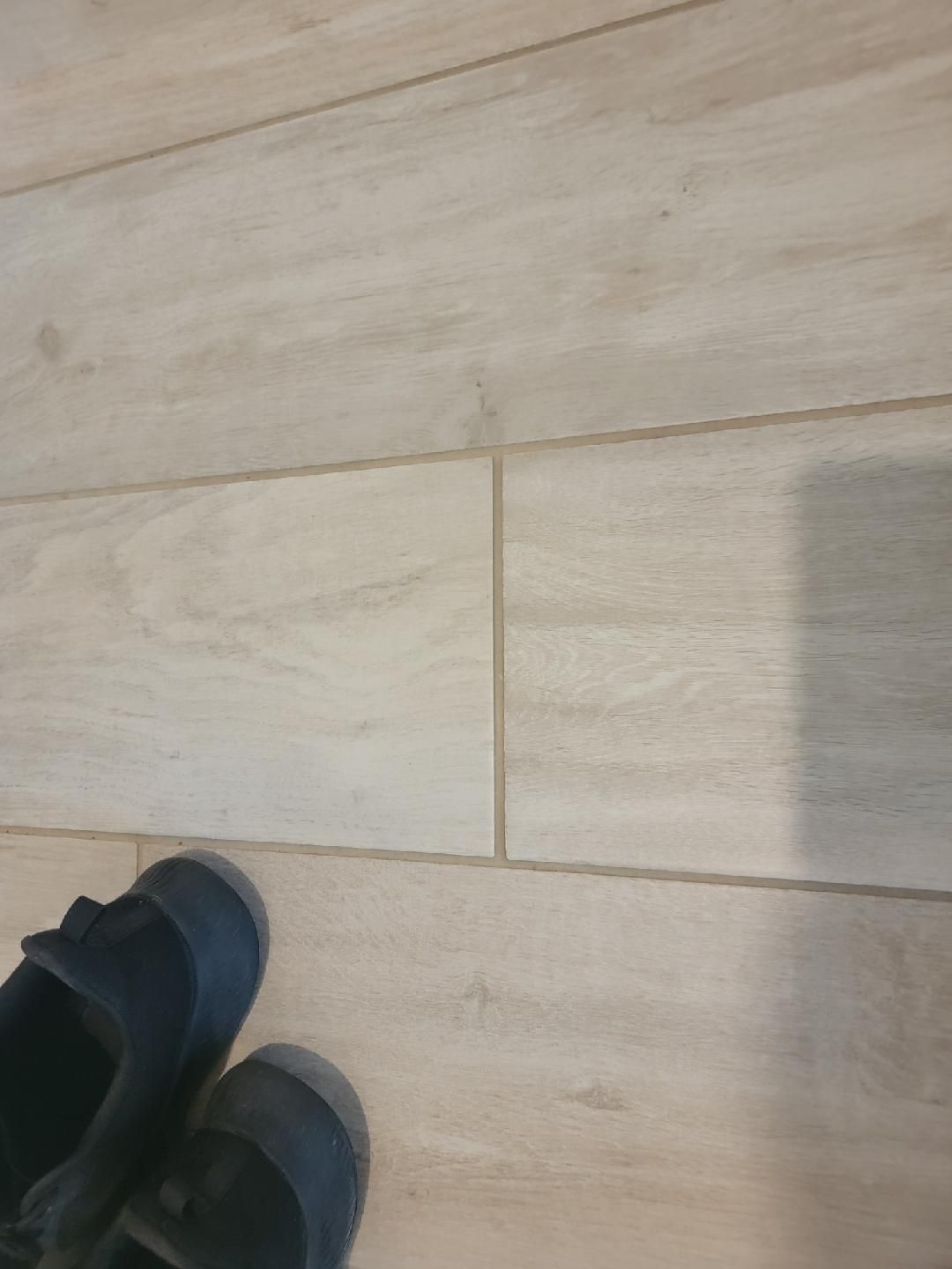 A pair of shoes sitting on top of a wooden floor.