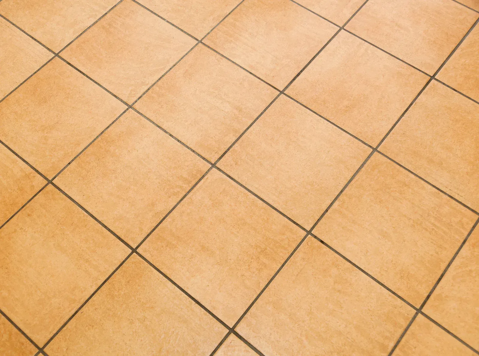 A close up of a tiled floor with a checkered pattern