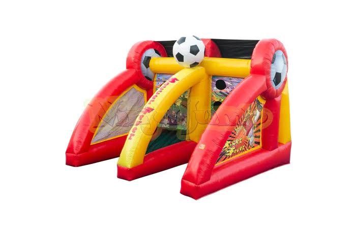 A red and yellow inflatable soccer goal with a soccer ball on top of it.