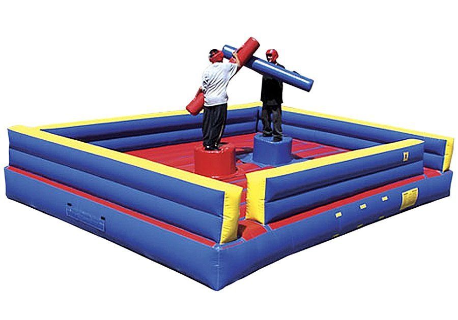 Two people are playing a game on an inflatable ring.