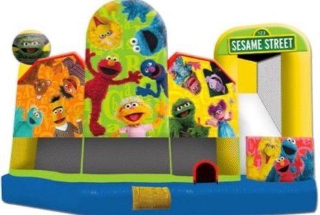 A bouncy house with sesame street characters on it