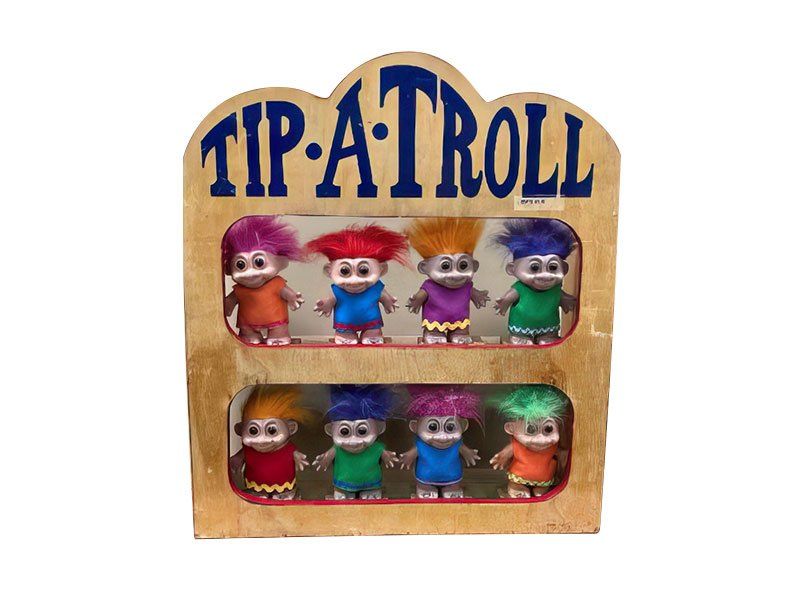 A wooden display with trolls on it that says tip-a-troll