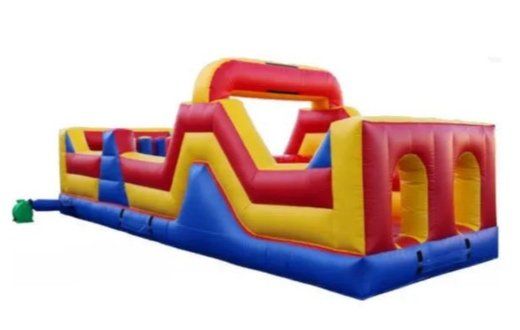 A red yellow and blue inflatable obstacle course on a white background
