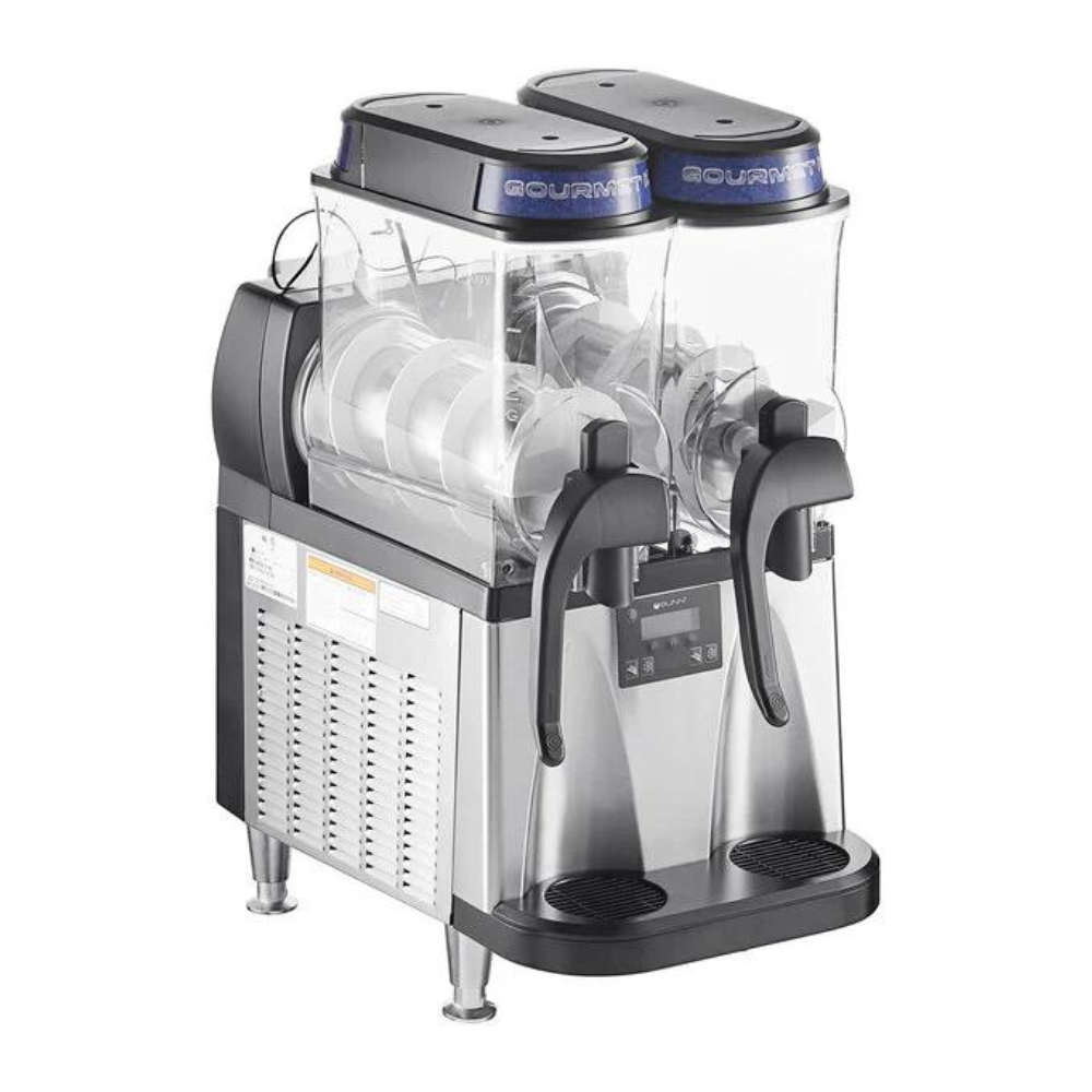 A slush machine is sitting on a white surface.