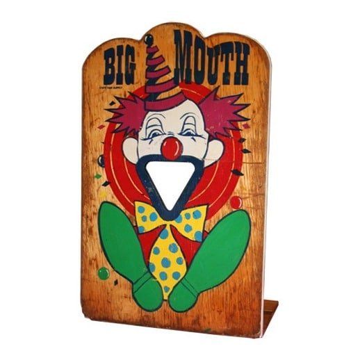A wooden sign with a clown on it that says big mouth