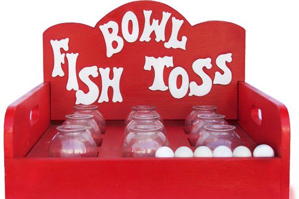 A red bowl fish toss game with balls and bowls