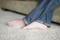 Bare feet on carpet cleaned by our carpet and upholstery cleaners in Malua Bay