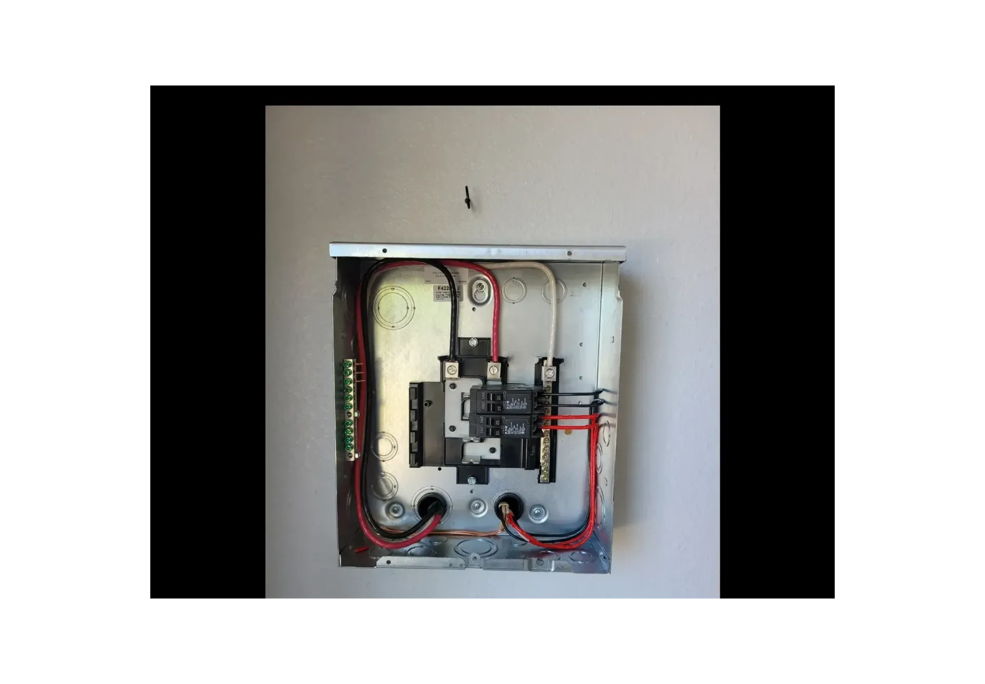 A picture of a box with wires coming out of it.