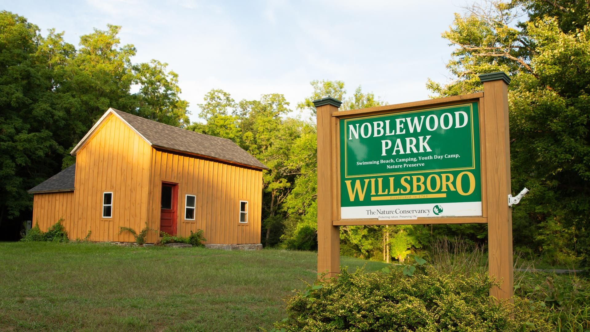 A man and a woman are preparing food in a kitchen.