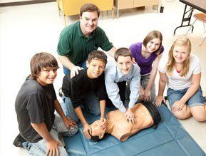 children practicing first aid courses