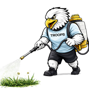 Mascot spraying on grass.