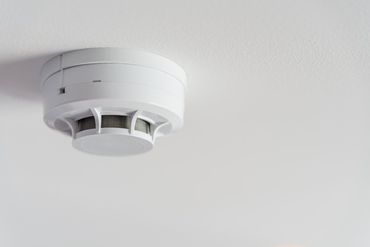 Close up smoke detector on a ceiling