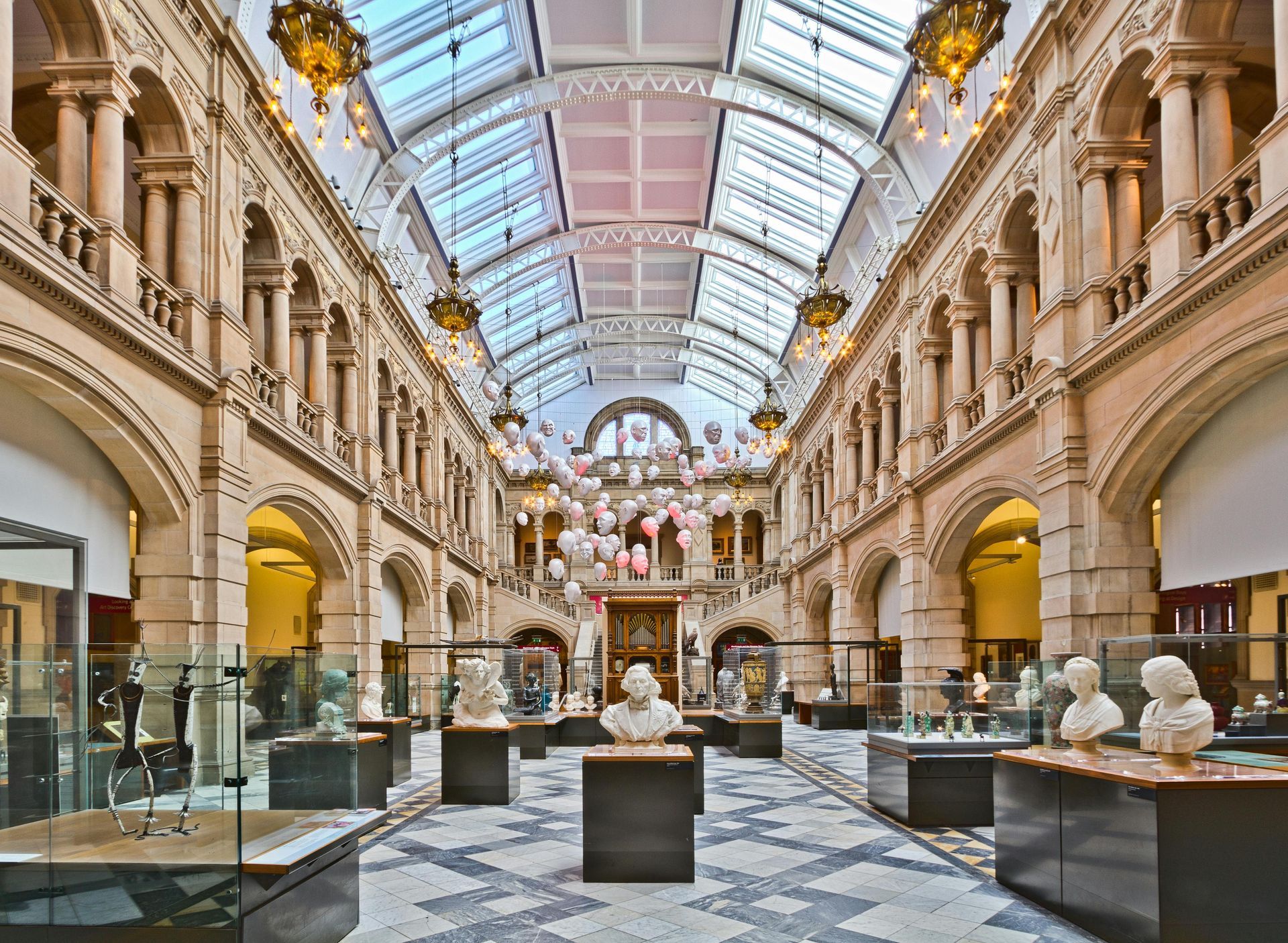 A large building with lots of statues on display in a museum.