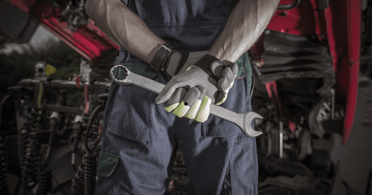 a mechanic holding a wrench