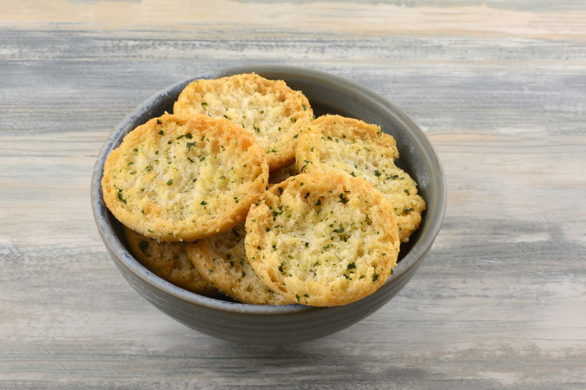Bowl of bruchetta  on a wooden table.