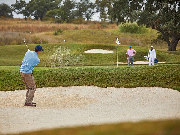 Men Playing Spanish Oaks Golf Course