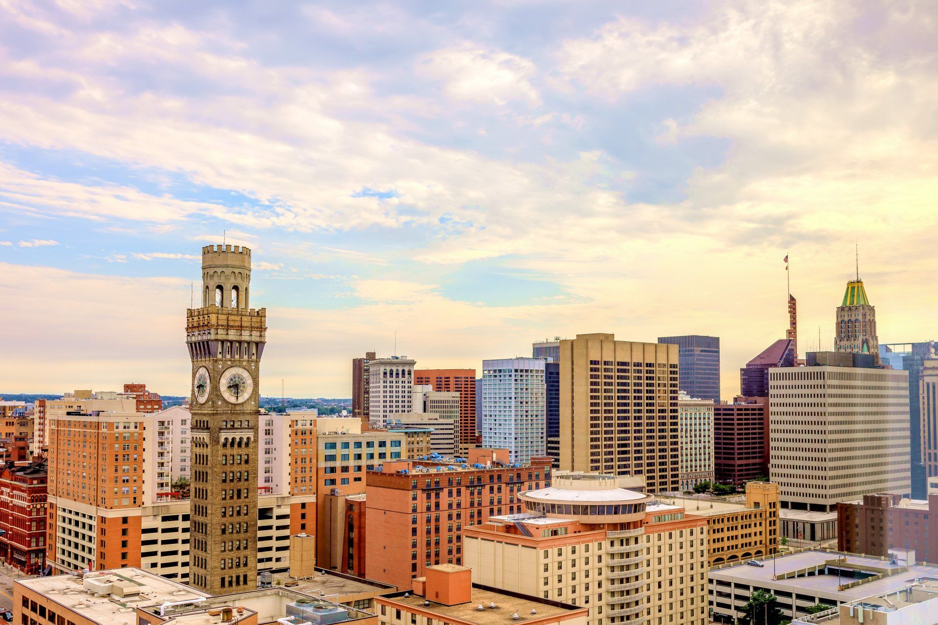An aerial view of a city skyline with a clock tower in the foreground.