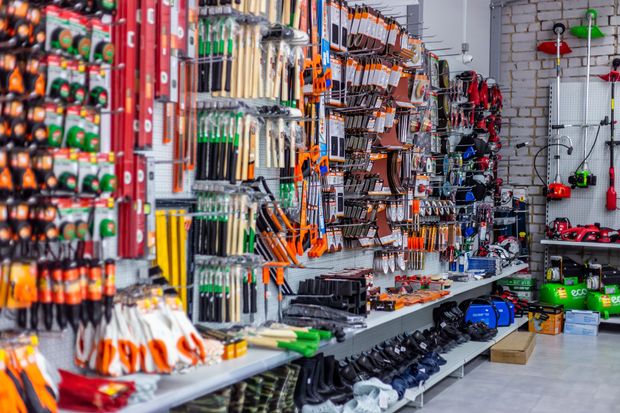 Hardware store display of tools and equipment on shelves.