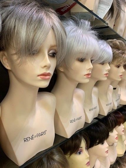 A Row Of Mannequin Heads With Wigs — Roseville, CA — Love Your Hair Wigs