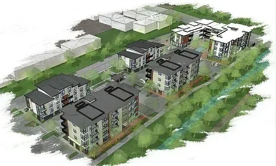 Aerial view of apartment complex with several multi-story buildings, gray roofs, and green landscaping.