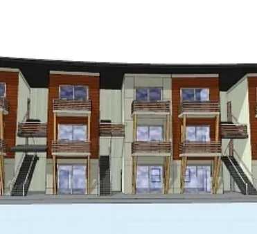 Multi-story apartment building with balconies, wood and neutral color facade.