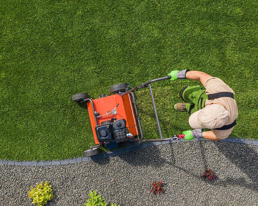 Worker Using Lawn Mower